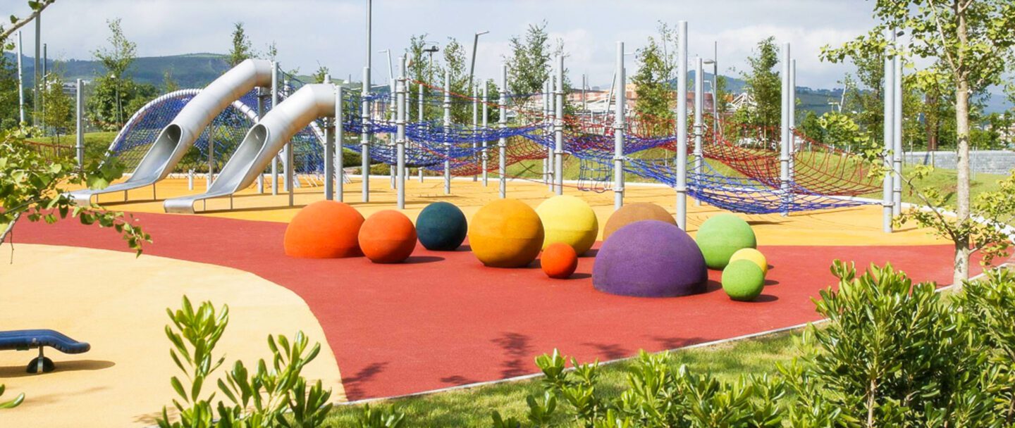 Playground with safety surface applied. 3d play spheres in the foreground.