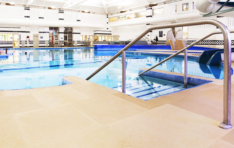 Life Floor safety surfacing tiles installe around a swimming pool.