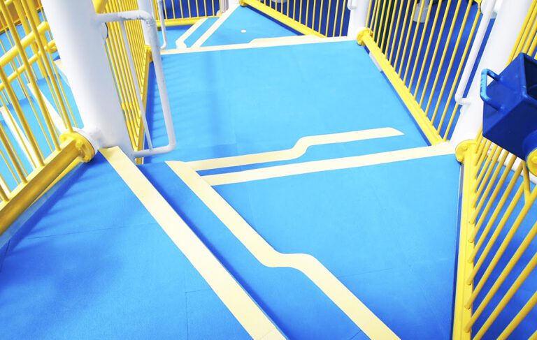 Blue Life Floor safety surfacing installed over steps on water play equipment.