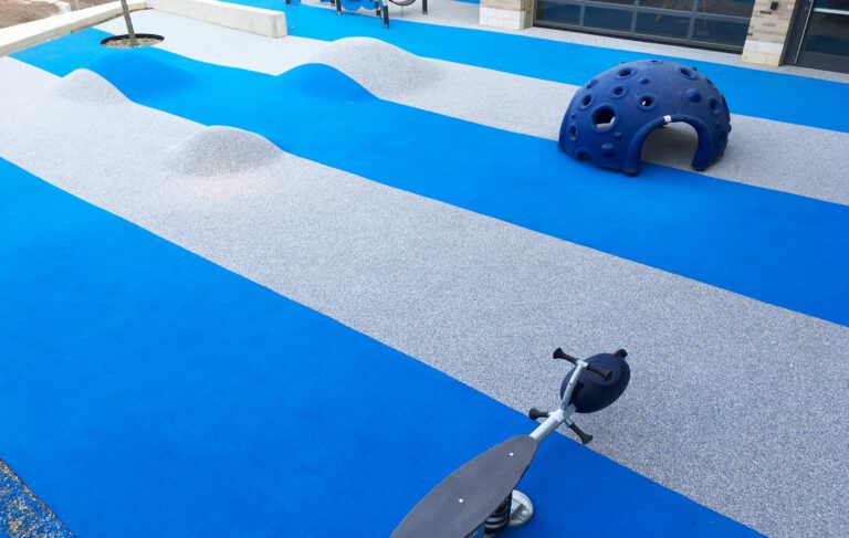 AquaSeal Resurfacing, LLC offers Play Flecks Safety Surfaces for playgrounds.