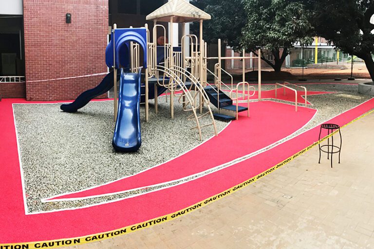 Play Flecks safety surfacing system installed on a school playground.