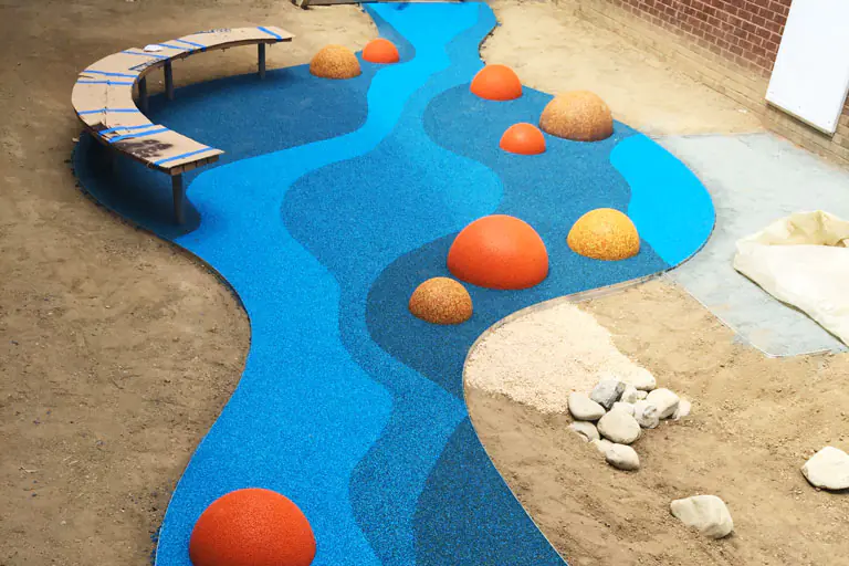 Half spheres safety surface installation, February 2025